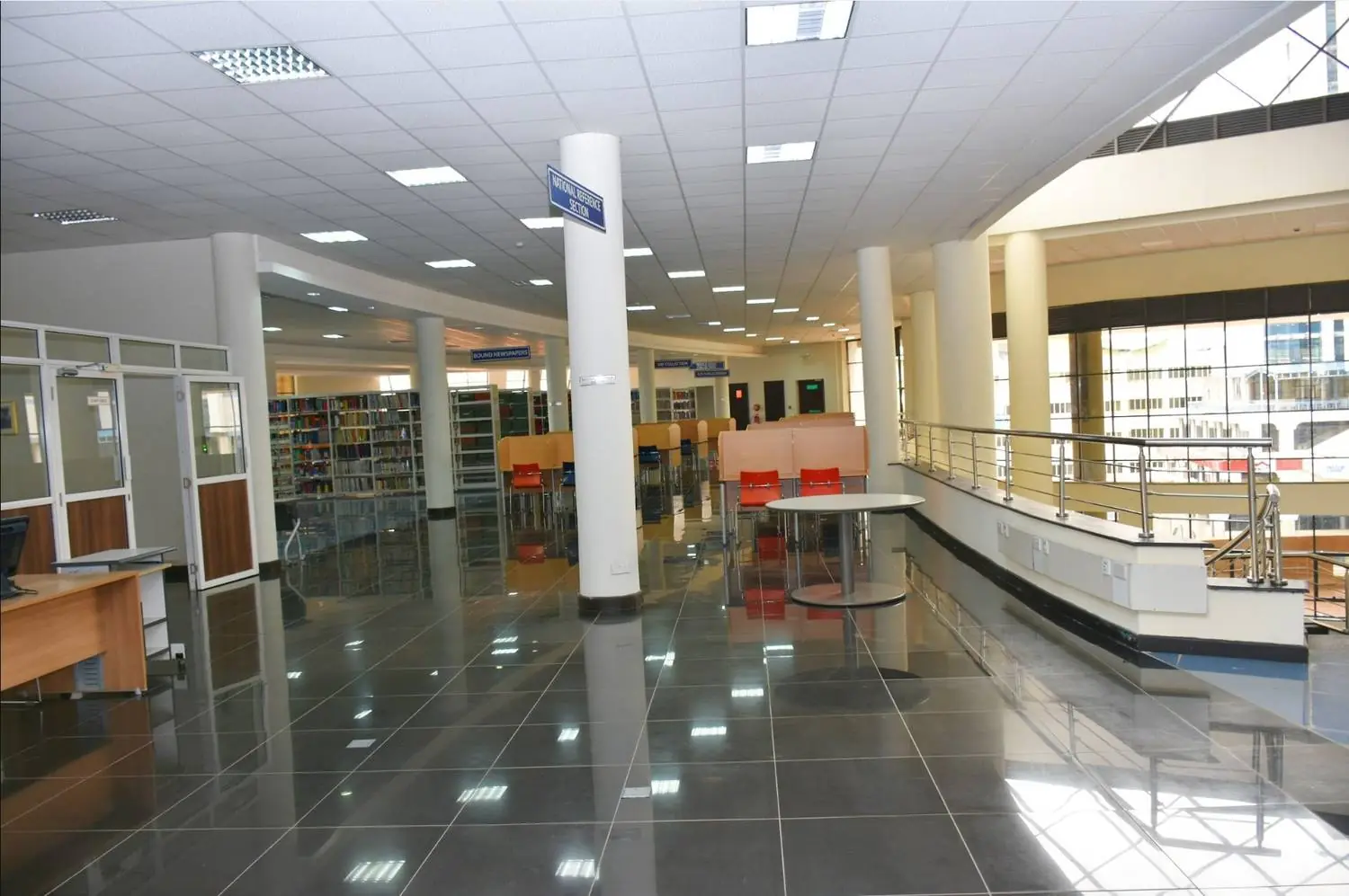 Children selecting books at a KNLS reading activity
